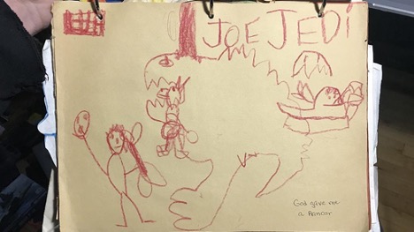 A children's drawing by the author showing the Rancor monster and a few humanoid stick figures. The word Joe Jedi is prominently featured on the top right.