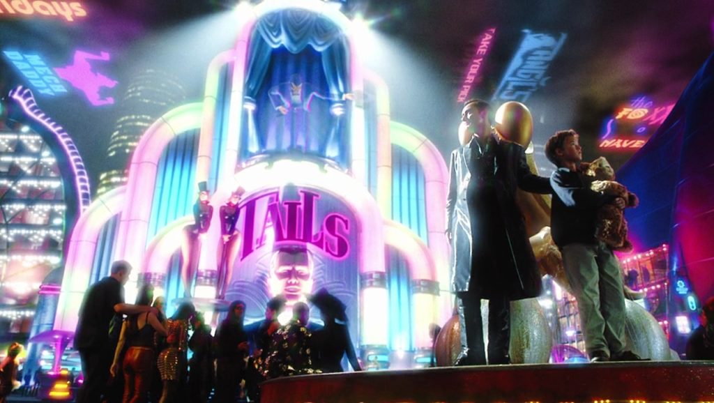 David (Haley Joel Osment) and Gigolo Goe (Jude Law) in Rouge City—a futuristic, brightly lit environment filled with holograms and flashing lights.