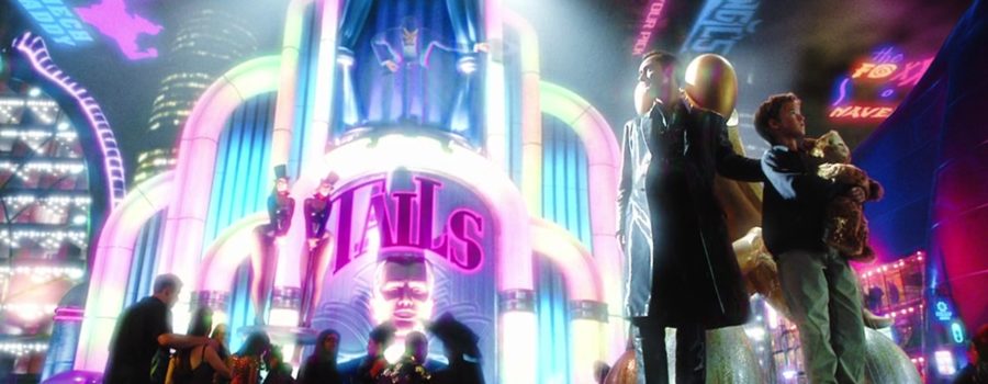 David (Haley Joel Osment) and Gigolo Goe (Jude Law) in Rouge City—a futuristic, brightly lit environment filled with holograms and flashing lights.