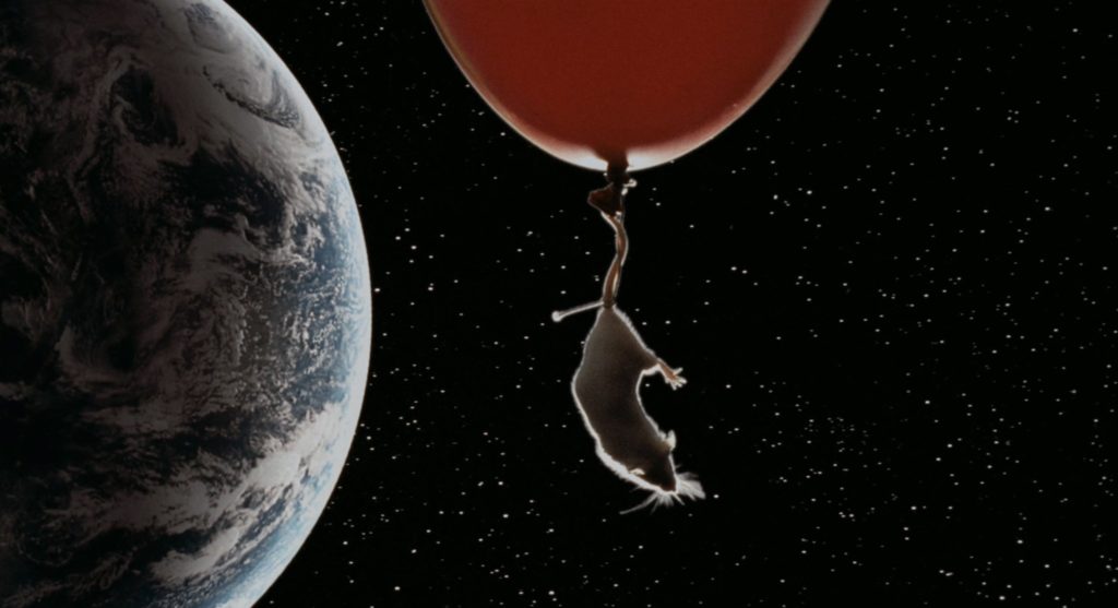 Snowball the Rat floating to the moon in a fantasy sequence.