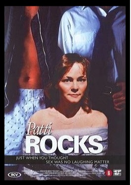 "Patti Rocks" promotional poster in which Patti is in the foreground, two men in various states of undress are behind her. 