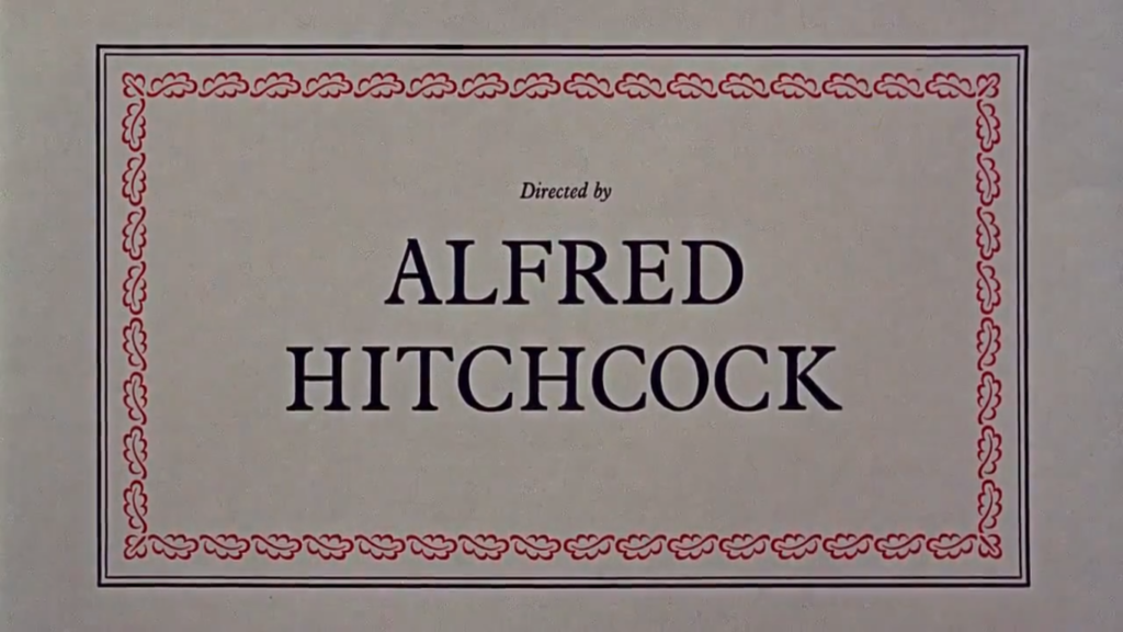 A title card from "Marnie" with a red border on an off-white screen, reading "Directed by Alfred Hitchcock."