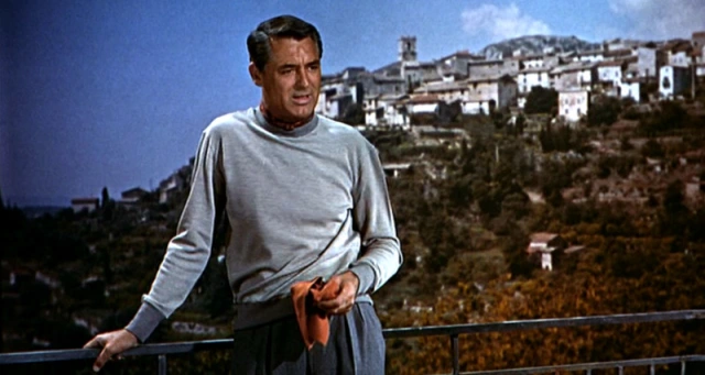 Cary Grant in "To Catch a Thief" wearing a light blue, long-sleeved shirt.