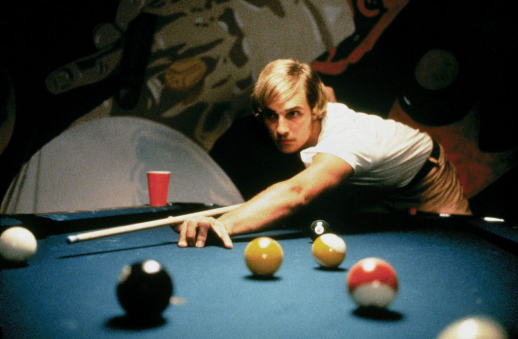 Image of Matthew McConaughey in the role of David Wooderson playing pool.