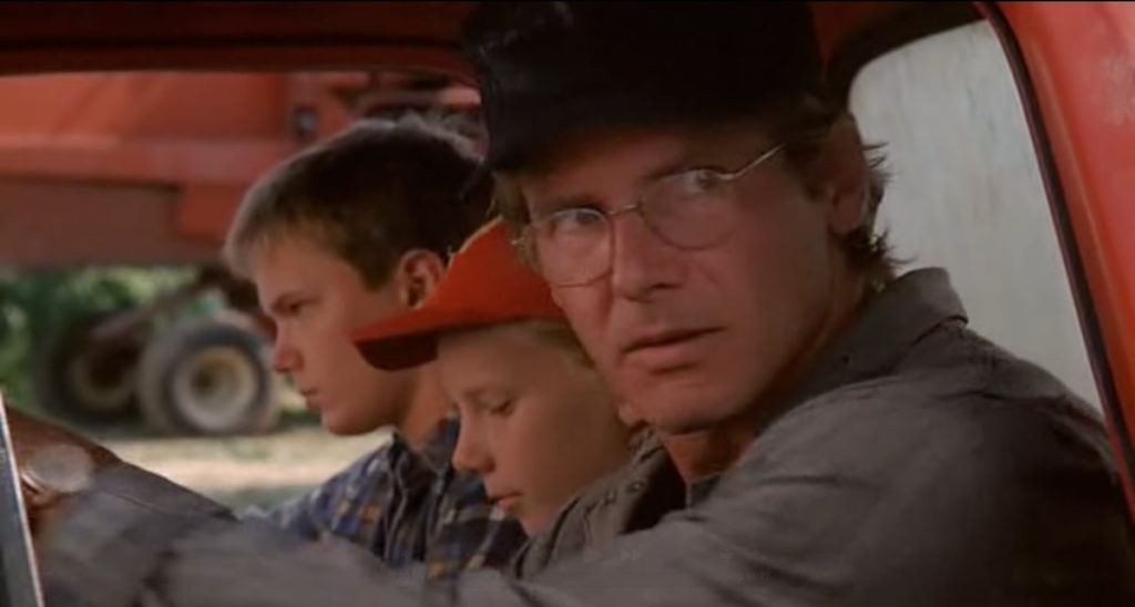 Harrison Ford in car with children in The Mosquito Coast.