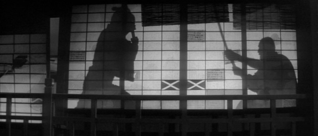 Silhouettes of two samurai fighting