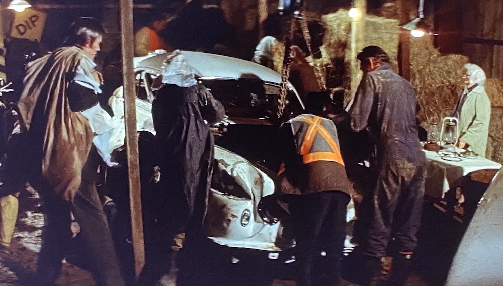 Citizens of the town of Paris dismantle a car in their chop shop.
