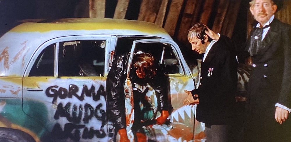 The mayor of Paris consoles Waldo at the side of a bloody car crash.