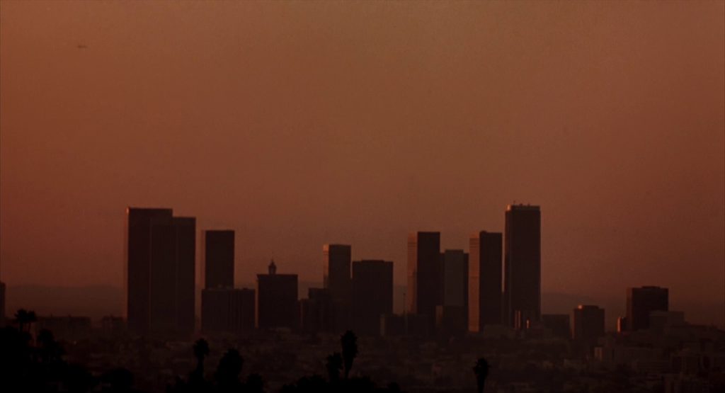Sun rises over LA skyline.
