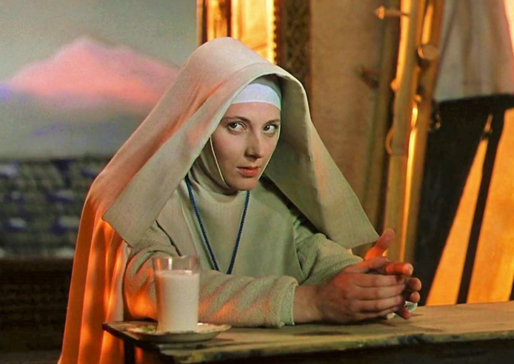 Sister Ruth glares menacingly while drinking a glass of milk.