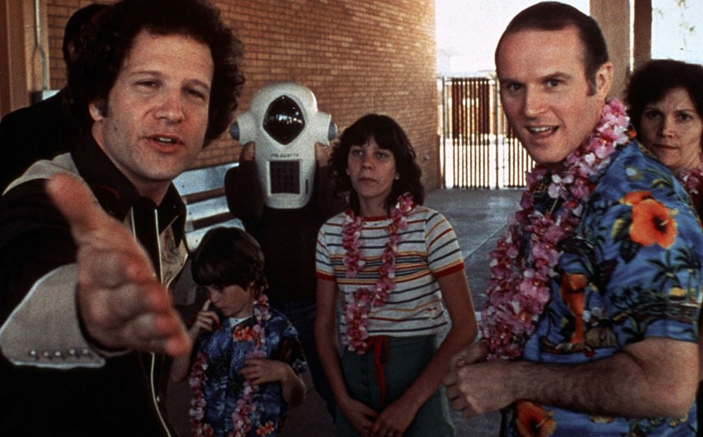 Albert Brooks welcomes the Yeager family back to their home in Phoenix after a paid trip to Hawaii. The Yeagers will be subjects of Brooks’ documentary about the American family during that year.