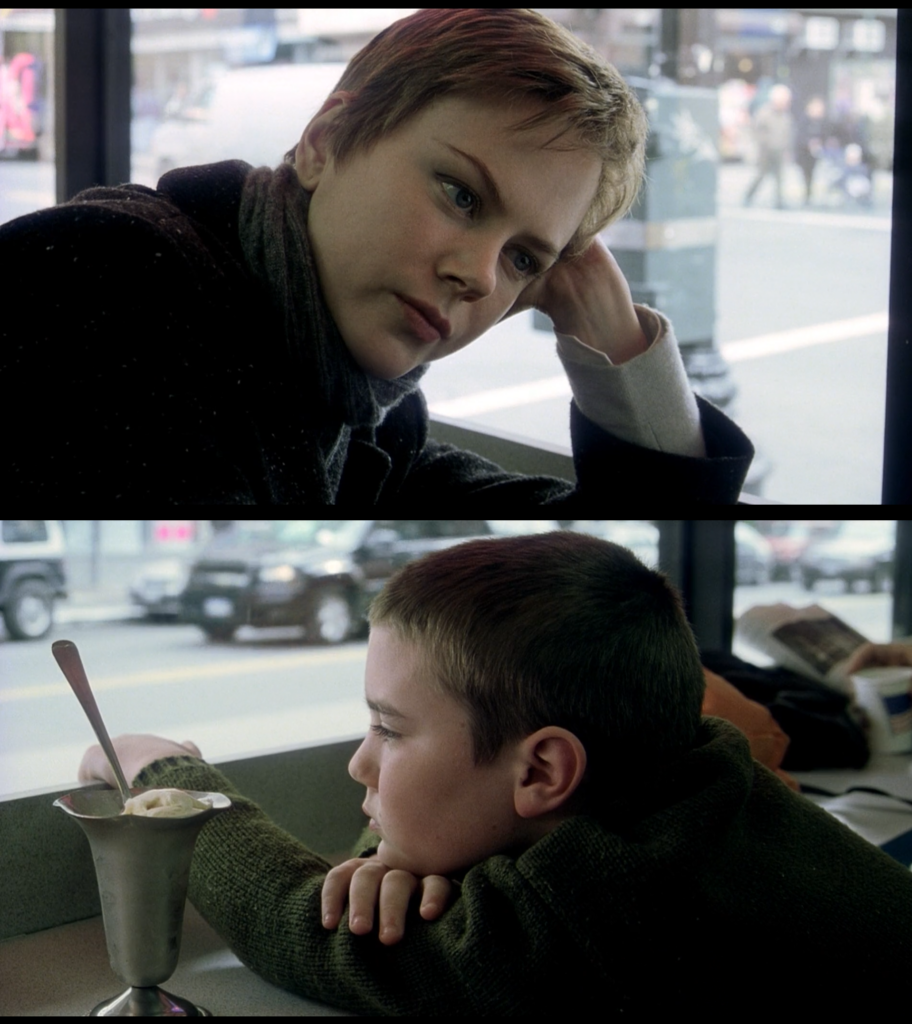 wo shots from the film side by side. The top image is Nicole Kidman looking off to the right inside a diner. The bottom image is a young boy looking contemplatively out the window next to a metal cup filled with ice cream