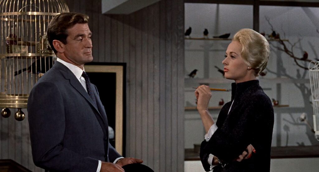 Rod Taylor and Tippi Hedren in a pet store in The Birds