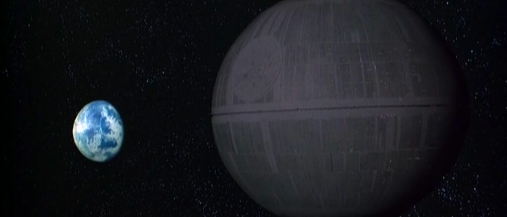 A globe-shaped space station, the Death Star, appears in the near ground, dwarfing a blue-and-white planet on the left.