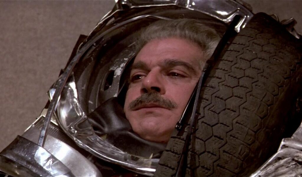 Omar Sharif trapped inside compacted car