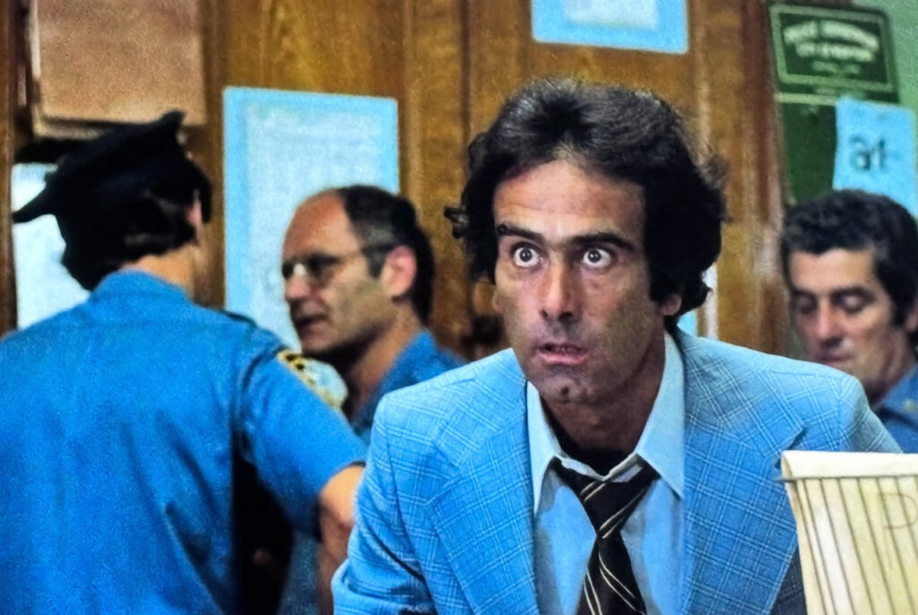 Dan Hedaya as Sergeant Barnes glares intensely at Sean Boyd off screen.