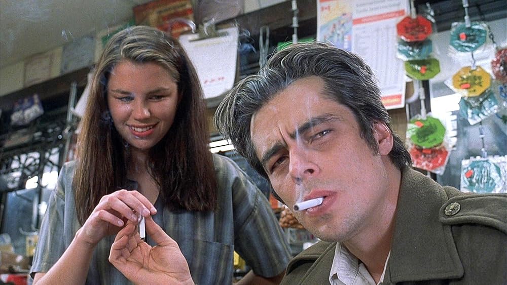 Longbaugh charms a young gas station attendant while they share smokes