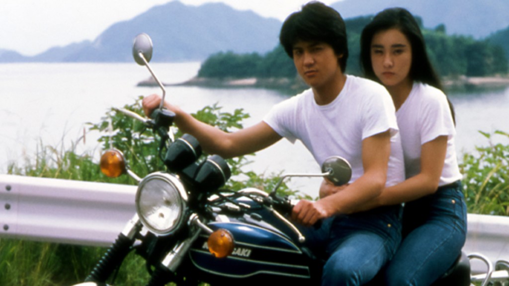 Koh and Mio pose on his Kawasaki motorbike