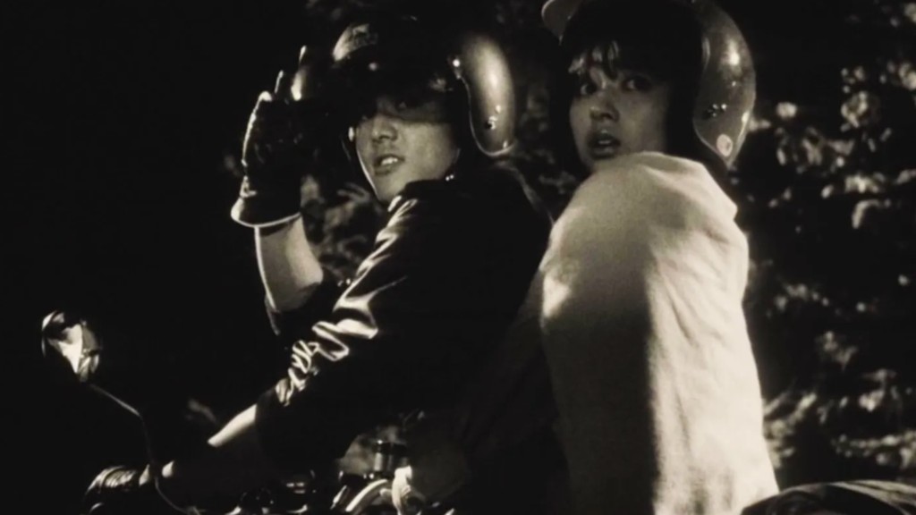 Ko and Fuyumi in black and white. Fuyumi looks distressed.