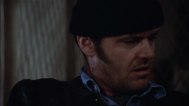 A pensive and confused Randle Patrick McMurphy looks off screen to the right