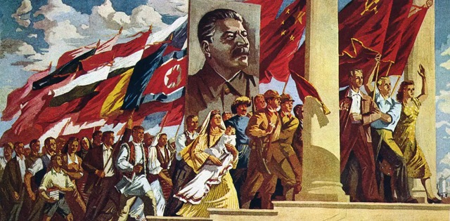 A parade of men, women, and children dressed in 1950s era clothing, including era-appropriate Russian garb, walking up a staircase with a giant stalin portrait in the center.