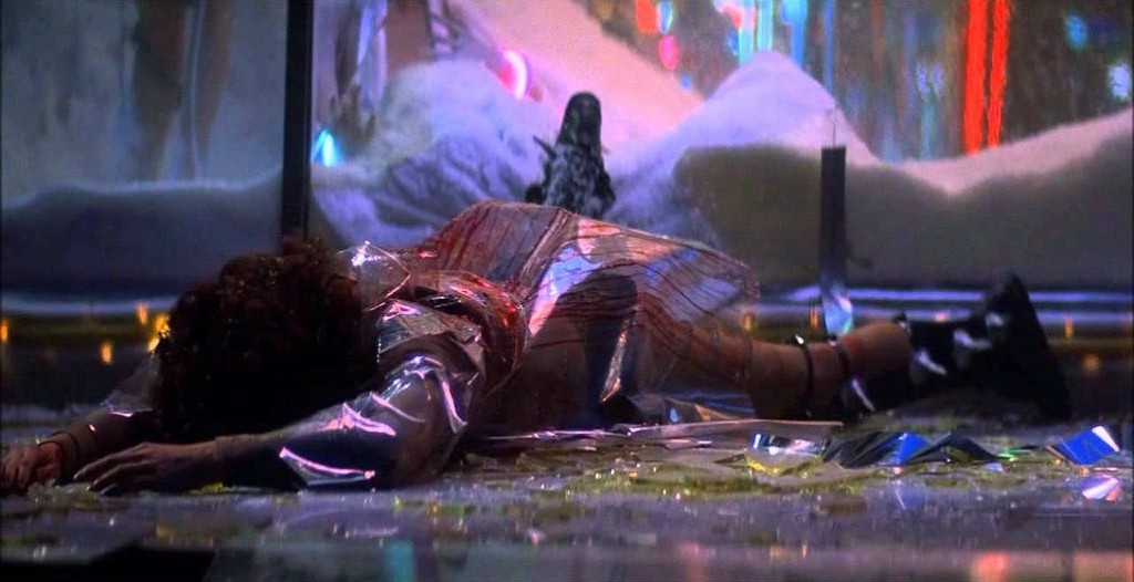 Zhora Salome (Joanna Cassidy) lies dead, face down in the street surrounded by broken glass