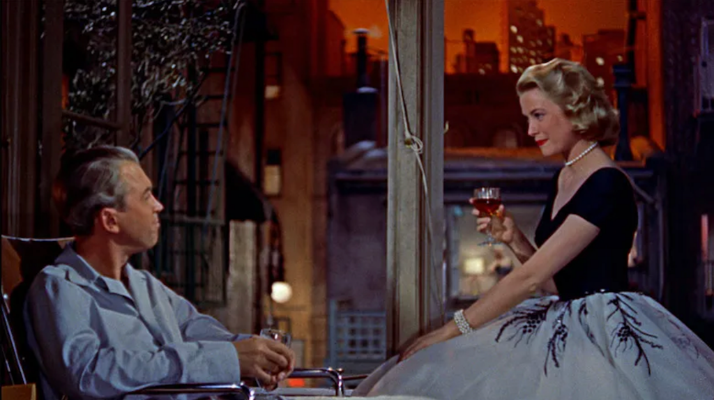 a white, gray-haired man and a white, blonde woman both holding drink glasses