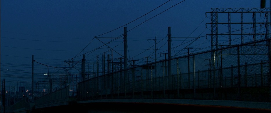  Power lines over rail tracks near dawn.