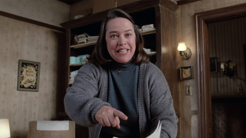 a smiling, white, brown-haired woman